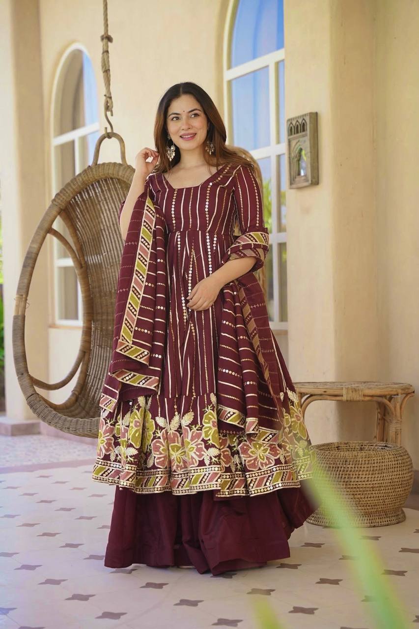 Majestic Maroon Flared Anarkali Suit Set Adorned with Luminous Sequin Stripes and an Ornate Floral Embroidered Hemline